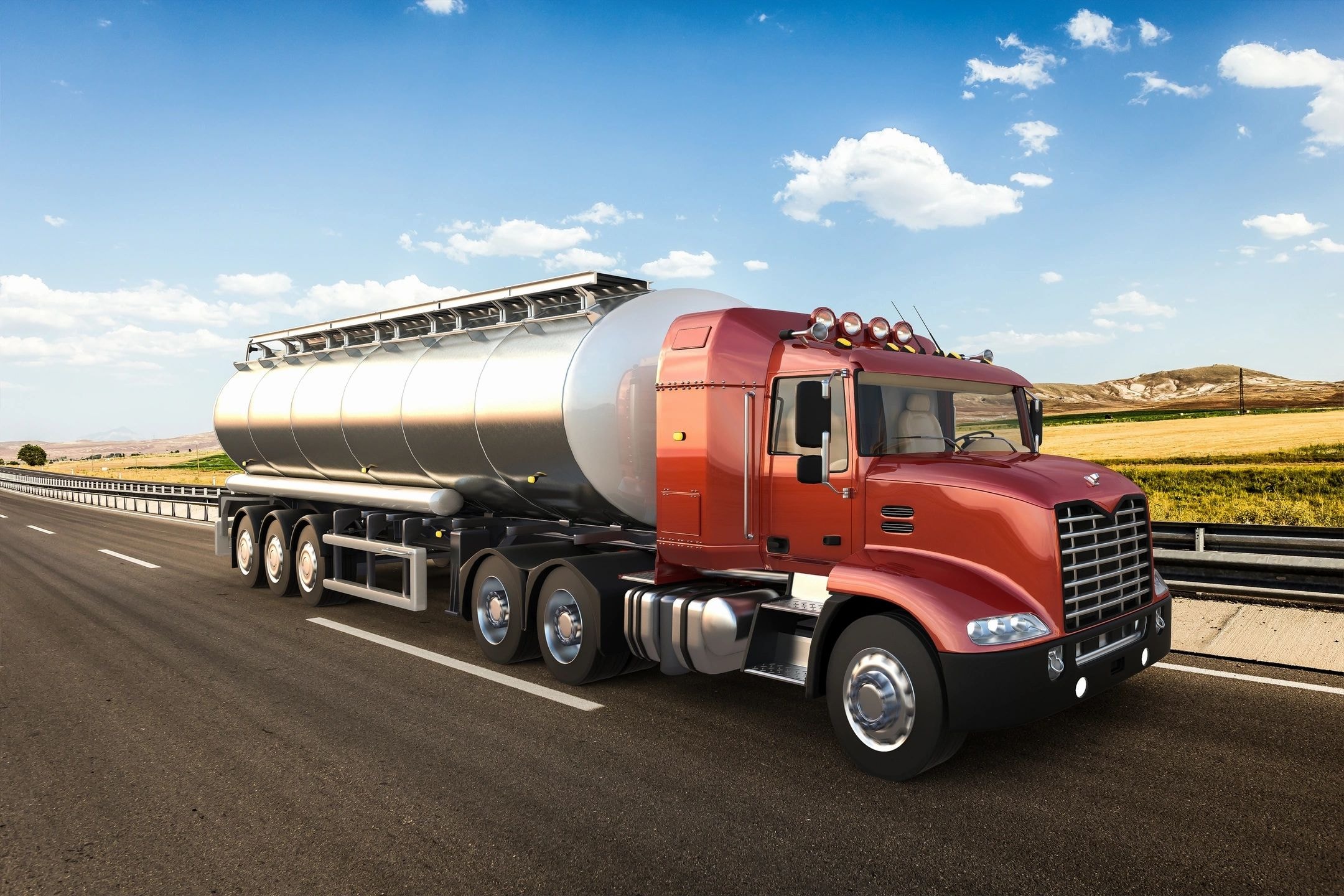 Red tanker truck on highway